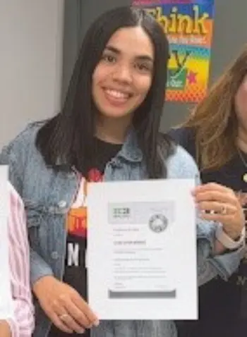 Leticia Rodriguez holding her IC3 Digital Literacy certificate