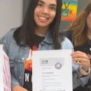 Leticia Rodriguez holding her IC3 Digital Literacy certificate