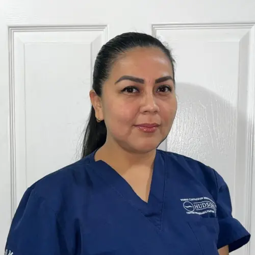 Yamirli Lojano Cruz wearing CNA scrubs